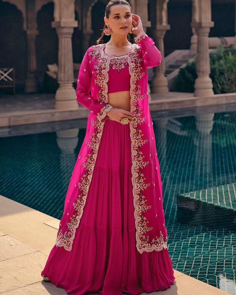 Party Wear Lehenga Choli With Long Shrug Style Koti https://www.urmifashion.com/lehengas/koti-style-lehenga-choli/rani-pink-real-chinon-silk-koti-style-lehenga-choli-uf167-3 #lehenga #lehengacholi #lehengacholionline #lehengas #lehengalove #stylishlehenga #partywearlehenga #designerlehenga #festive #festivewear #lehengalove #festivecollection #onlinestore #indianclothing #clothingstore #clothing #clothingforwomen #fashionstyle #shopping #ethnicwear #womenclothing #partywear #designer #trendi... Shrug Style, Suit With Jacket, Long Shrug, Saree With Belt, Banarasi Lehenga, Rani Pink, Lehenga Suit, Party Wear Lehenga Choli, Pink Lehenga