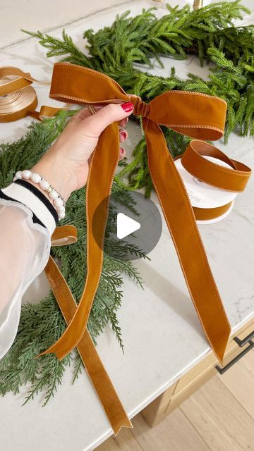 Kasey Dixon on Instagram: "DIY \ how-to tie a holiday BOW✨ Taking my wired velvet ribbon from Amazon and showing y’all how to do it🎀 Making sure the velvet is facing YOU! Try it with me! I use these all around the house on my Christmas wreaths, stairway garland and swags. Happy BOW making!xx

Comment BOW below to receive a DM with the link to shop this post on my LTK 🔗🔗 https://liketk.it/4WCEf

#bowseason #bows #christmasbow #howtotieabow #bowtutorial #christmasbows #christmasbow #amazonhome #amazonhomefinds" How To Make A Flat Bow With Ribbon, Tying A Bow For A Wreath, Cowboy Hat Christmas Wreath, Wire Edged Ribbon Bow Diy, Christmas Garland With Velvet Ribbon, Wreath Bows How To Make Easy, Tie Velvet Ribbon Bow, Velvet Bow On Wreath, Velvet Bow Garland Diy