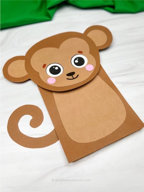 This monkey paper bag puppet is a fun and easy craft project the kids will love. It's perfect for a zoo or jungle themed party, or just for some animal-themed fun. With just a few simple supplies, you can make your own monkey puppet in no time! Download the printable template and make it with preschool, kindergarten, and elementary children. Monkey Paper Bag Puppet, Monkey Puppet Craft, Monkey Craft Preschool, Paper Bag Puppet Craft, Jungle Animal Crafts, Rainforest Crafts, Monkey Craft, People Craft, Puppet Template