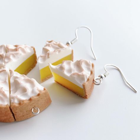 Yes, I’m fully embracing all the pies. Today, lemon meringue! Available right now! Which type of cake or pie should I turn into jewelry next? 🤭🍰 . . . . . . . #polymerclay #handmadejewelry #earrings #foodart #lemon #lemonmeringue #lemonpie #bakingtiktok #cakedecorating #etsyprocess #smallbusiness #sculpey #handmadeearrings #polymerclayearrings #artistsoftiktok #miniatures #desserts #desserttiktok ￼ Drumstick Ice Cream, Pie Earrings, Pie Slice, Cream Earrings, Lemon Filling, Pie Tops, Banana Cream Pie, Lemon Meringue Pie, Food Earrings