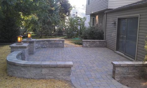 We removed an existing brick patio that was about 20 years old, and replaced it with this! We used Techo-Bloc Parisien pavers with a Rotondo circle kit, and Mini-Creta walls. The pier lights are solid copper, and manufactured locally by Escort Lighting. LED wall lights are from Integral, again a local company. Swiss Cottage, Raised Patio, Build Outdoor Kitchen, Custom Countertops, Patio Wall, Brick Patios, Patio Landscaping, Pergola Patio, Paver Patio