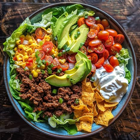 🥗 Unleash flavor with our Loaded Taco Salad! Fresh, zesty, and packed with goodies! #TacoTuesdayEveryDay 🍽️ Loaded Taco Salad 🛒 Ingredients: 500g ground beef 1 packet taco seasoning 1 head lettuce, chopped 1 cup cherry tomatoes, halved 1 avocado, diced 1/2 cup cheddar cheese, shredded 1/2 cup sour cream 1/2 cup salsa Tortilla chips, crushed 👩‍🍳 Instructions: Cook: Brown beef with taco seasoning. Layer: In a large bowl, layer lettuce, beef, tomatoes, avocado, and cheese. Serve: Top with so... Taco Salad Ingredients, Instagram Recipes, Healthy Food Dishes, Taco Salad, Taco Seasoning, Tortilla Chips, Clean Recipes, Large Bowl, Diy Food Recipes