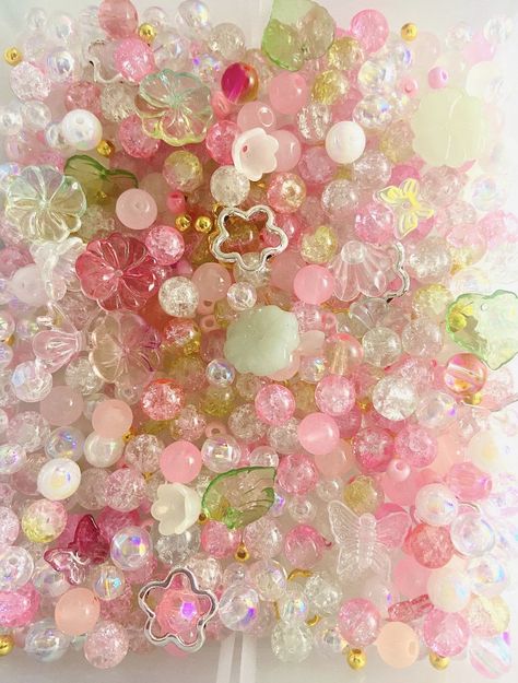 "Fairy garden pink bead mix. Super trendy 90s y2k Kandi bead mix.  Great for BFF, stretch bracelet making, kids activity kit, gifts for craft lovers, rainy day activities, tea parties, and all your DIY jewelry needs.  -package size: we sell the beads by weight: 1oz is 30g, about 50pcs+.  -Bead materials: glass beads, seed beads, acrylic beads, faux pearls, alloy charms, etc. -bead shapes that you may receive:  flower beads charms leaf beads crackle glass beads seed beads faux pearl beads glitter Colorful Glass Beads, Name Bracelet Diy, Barbie Beads, Jewelry Making Aesthetic, Bead Aesthetic, Pearled Bead, Pink Fairycore, Bead Confetti, Aesthetic Beads