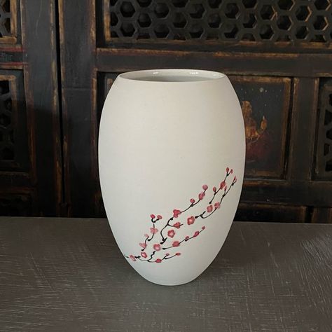 The flip side of a cherry blossom vase in bare porcelain. I love how the bare porcelain accentuates the cherry blossoms and it’s really easy to photograph since it’s not shiny lol . . . . #cherryblossom #cherryblossoms #porcelain #wheelthrownporcelain #ceramicsofinstagram #handpaintedporcelain #handmadewithlove #vase #porcelainvase Cherry Blossom Vase, Painted Pottery, Hand Painted Pottery, Keramik Vase, Hand Painted Porcelain, Porcelain Vase, Pottery Painting, Wheel Thrown, Cherry Blossoms