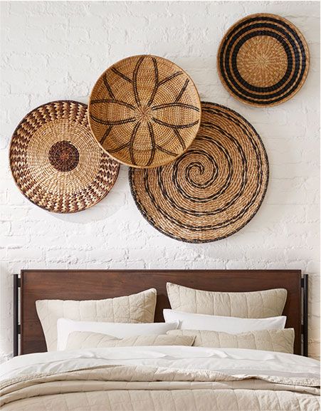 Woven Plates On Wall, Basket Wall Decor Modern, Baskets Above Bed, Bohemian Style Interior Design, Wall Decor Mirrors, Wall Basket Decor, Pottery Barn Living Room, Woven Wall Decor, Rustic Inspiration