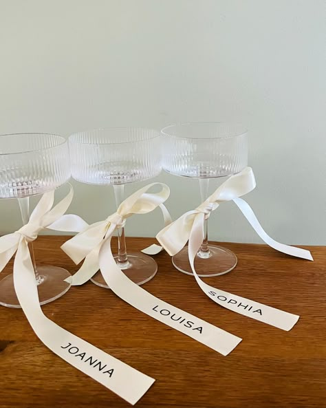 Champagne Coupe Glass & Personalised Ribbons - Now available. A large range of bow colours to suit your wedding theme 🥰 #bridesmaidproposal #bride #bridestobe #brides2025 #bridesmaidglass #brideglass #bridesofinstagram #bridestyle #bridesofuk #proposalbox #bridetribe #bridetrends #bridetribe💍 Bows On Champagne Glasses, Bridesmaid Glasses, Personalized Ribbon, Thanksgiving Table Settings, Proposal Box, Bride Tribe, Champagne Glasses, Bride Style, Thanksgiving Table