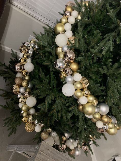 Gold silver ornaments garland  in process Ornaments Garland On Tree, Ornament Garland Christmas Tree, Christmas Ornament Garland For Tree, Christmas Tree Ornament Garland, Christmas Tree Ball Garland, Ornament Garland On Tree, Ornament Clusters On Tree, Ball Garland Christmas Tree, Blue Christmas Tree Decorations