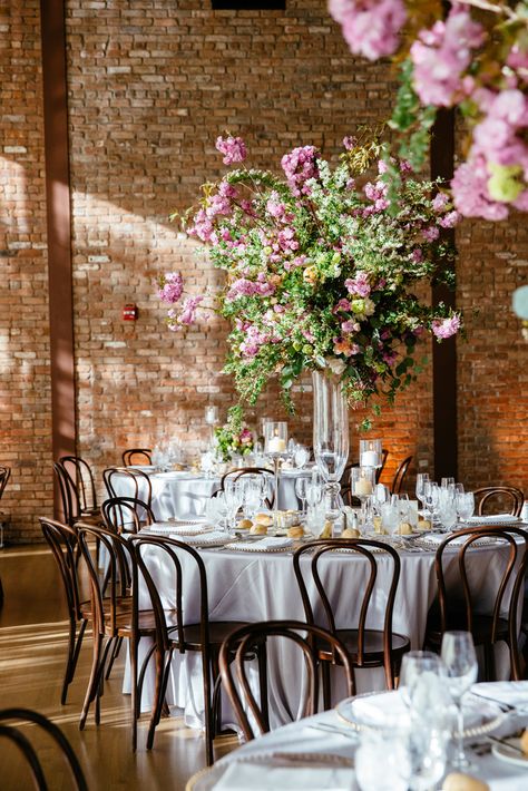 Tall Cherry Blossom Centerpieces | Tory Williams Photography https://www.theknot.com/marketplace/tory-williams-photography-new-york-ny-427900 | Fleurs NYC Tall Purple Centerpieces, Tall Floral Centerpieces Wedding, Cherry Blossom Wedding Centerpieces, Broadmoor Wedding, Elevated Centerpiece, High Centerpieces, Cherry Blossom Centerpiece, Cherry Blossom Decor, Pastel Pink Weddings