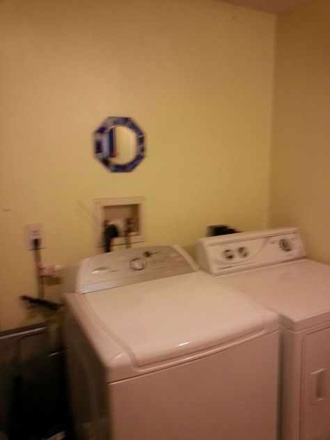 Hometalk :: Ideas to Cover the Plugs and Outlets over the Washer & Dryer Cover Washer And Dryer Hookups, Gray Tile Floor, Clean Shower Floor, Pocket Doors Bathroom, Dryer Hose, Laundy Room, Big Blank Wall, Rental Bathroom, Gray Tile