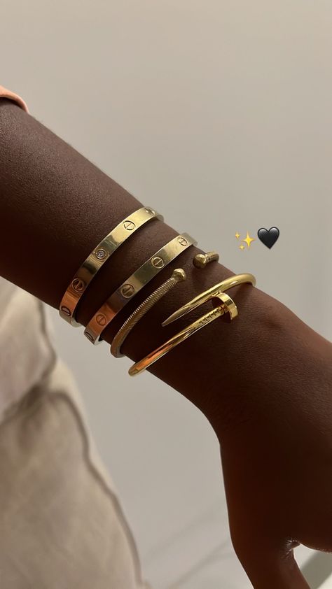 My bracelet stack includes the Cartier Love Bracelet and the Cartier Juste Un Clou nail bracelet. Black girl style, black girl luxury, bracelet stacking, fashion, style, style tips, jewelry, jewellery, and jewelry styling tips Cartier Nail Bracelet, Cartier Jewellery, Pinterest Creator, Cartier Juste Un Clou, 20th Bday, Bracelet Cartier, Gold Bracelets Stacked, Dope Jewelry Accessories, Cartier Love Ring