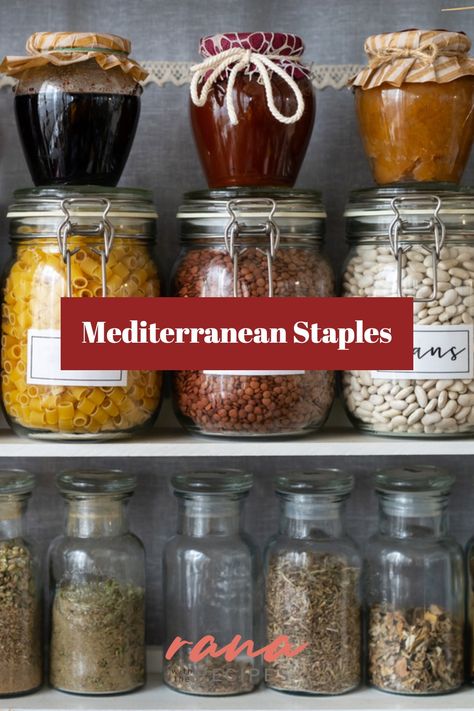 Close-up view of a pantry stocked with Mediterranean essentials like dry herbs, beans, pasta, and jams. Mediterranean Pantry Staples, Mediterranean Ingredients List, Mediterranean Diet Pantry Staples, Mediterranean Herbs And Spices, Mediterranean Staples, Mediterranean Food List, Mediterranean Pantry, Holistic Eating, Foods For Heart Health