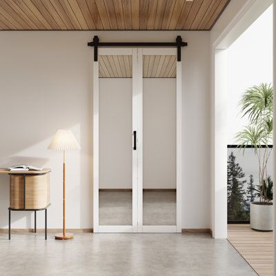 The double-layer barn door is made of MDF, which covers the PVC texture on the surface. Combined with a frosted glass design, it provides privacy and allows more light to enter the room. The new design provides unique functions and opportunities to save space. Multi-function: It can be used for a closet, room separator, kitchen, bedroom, bathroom, home office or food room, and access door. Size: 40" x 84" | Barn Door - HOZONE Mirrored Glass Bi-Fold Sliding Single Barn Door w / Installation Hardw