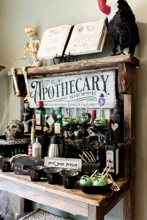 Witch Table Decorations Halloween Party, Spooky Apothecary Display, Potions Halloween Decor, Apothecary Halloween Party, Halloween Potion Bottles Display, Apothecary Table Decor, Witch Apothecary Halloween Decor, Halloween Apothecary Sign, Apothecary Display Ideas