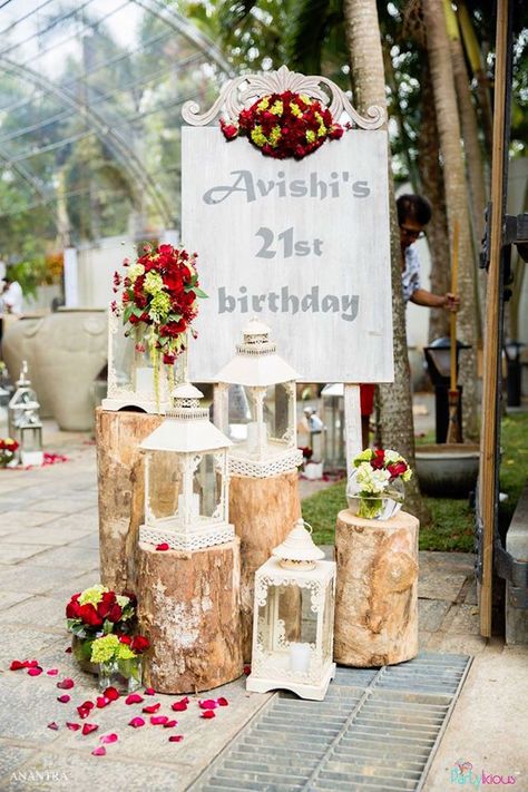 Welcome sign with rustic logs, flower petals, and lanterns from a Rustic Vintage 21st birthday Party at Kara's Party Ideas. See the pics at karaspartyideas.com! Rustic Birthday Party Decorations, 22 Birthday Decorations, Rustic Birthday Parties, Happy Birthday Beer, 21st Birthday Sign, Vintage Party Decorations, Vintage Birthday Parties, 21st Bday Ideas, Rustic Birthday