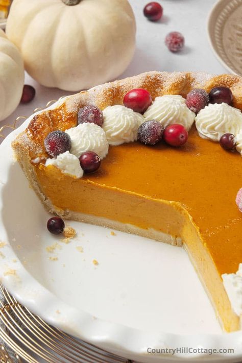 Up your pie game this Thanksgiving with this pumpkin custard pie recipe. It's a delicious twist on traditional pumpkin pie, has a buttery crust, and is filled with a creamy pumpkin spice custard with a rich, silky-smooth texture that is absolutely divine! Unlike traditional pumpkin pie, the custard filling is cooked on the stove. The result is a rich, velvety texture, smooth consistency, and a glassy, shiny top. Made with brown sugar, maple syrup, vanilla and spices. | CountryHillCottage.com Silky Smooth Pumpkin Pie, Custard Pumpkin Pie, Pumpkin Pie Filling Recipe, Creamy Pumpkin Pie Recipe, Pumpkin Custard Pie Recipe, Pumpkin Custard Pie, Pie Game, Creamy Pumpkin Pie, Traditional Pumpkin Pie