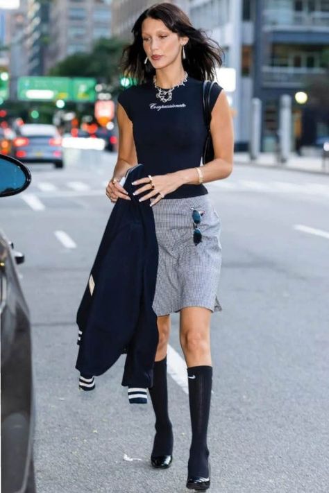 Look of the day for August 11, 2022 features Bella Hadid wearing knee-high socks with loafer pumps and a Michael Kors bag. Shop the look, here. #fashion #lookoftheday #style #womensfashion Pumps And Socks Outfit, Knee High Skirt Outfits, Knee High Socks Outfit Summer, Knee Skirt Outfits, Pumps With Socks, Skirt And Knee High Socks, Knee Socks Outfits, Knee High Skirt, Grey Shorts Outfit