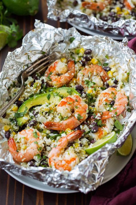 Shrimp Foil Packets That’ll Have Dinner Ready in 30 Minutes - Southern Living Foil Packet Recipes, Cilantro Shrimp, Foil Pack Dinners, Homemade Cajun Seasoning, Foil Pack Meals, Cilantro Lime Shrimp, Foil Dinners, Foil Packs, Foil Packet Meals