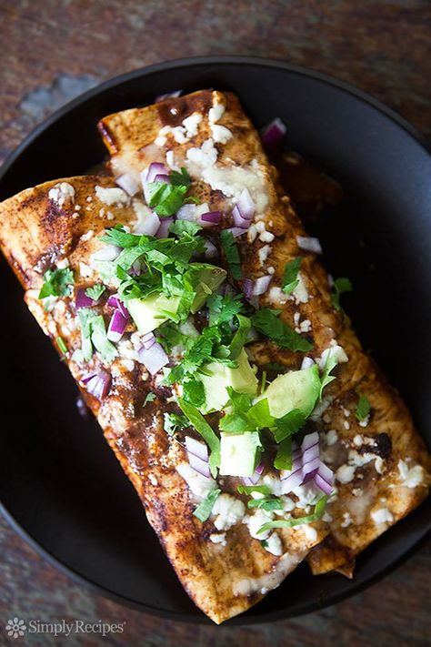 Turkey enchiladas made with leftover cooked turkey, homemade chili sauce, onions, black beans, and Monterey jack cheese. Topped with red onions, avocado, and cilantro. Enchiladas Turkey, Turkey Pot Pie Soup, Homemade Chili Sauce, Spicy Turkey, Turkey Enchiladas, Sliced Avocado, Holiday Leftovers, Black Bean Enchiladas, Pot Pie Soup