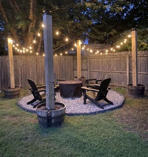 Fireplace lighting cozy backyard adirondack chairs fire pit fireplace baskets string lights Fire Pit Lights Ideas, Fire Pit Ideas Backyard Simple, Fire Pit Ideas Backyard On A Budget, Small Backyard Fire Pit Ideas, Fire Pit Lighting Ideas, Fire Pit Patio Ideas, Chairs For Garden, Fireplace Baskets, Outdoor Fire Pit Area