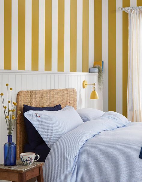 A timeless yet contemporary wallpaper, this classic, wide stripe is an iconic wallpaper print pattern. The stripes are brought to life in a beautiful, warming antique gold tone which is perfectly contrasted by a warm neutral stripe. Printed on a matt substrate for a contemporary look and feel. This wallpaper is also paste-the-wall, making it easy to hang. Best-loved British country lifestyle brand, Joules is delighted to introduce a collection of bold and beautiful wallpaper designs inspired by Iconic Wallpaper, Stripe Wallpaper, Contemporary Wallpaper, Wallpaper Direct, Yellow Wallpaper, Striped Wallpaper, Gold Wallpaper, Wallpaper Samples, Blue Wallpapers