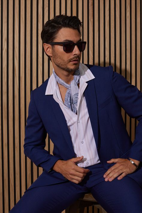 Modernize your suit styling. Couple a popped collar with a deep blue suit for an unexpected, yet sophisticated look. Deep Blue Suit, Popped Collar, Sophisticated Look, Suit Separates, Blue Suit, Clothing Co, Summer 2023, Deep Blue, Slim Fit