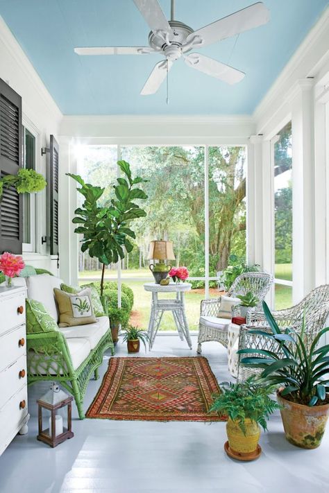 An Elegant 800-Square-Foot Cottage - The Glam Pad Small Guest Rooms, Blue Ceiling, Florida Cottage, Southern Cottage, Pine Dining Table, Small Cottage Homes, Florida Room, Small Porches, Front Porch Decorating