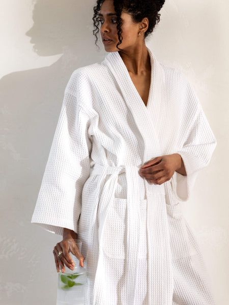 Our plush pure-cotton robes will cocoon you in comfort. Featuring a shawl collar, patch pockets and designed as a longer line silhouette, this luxury spa-like waffle robe is lightweight, absorbent and fast drying. 100% cotton waffle robe, white Length of back to hem 122cm Unisex - one size Bath Robe White, White Waffle Robe, Bath Robe Cute, White Bath Robe, Bathroom Robe Aesthetic, Cute Robes For Women, Bath Robe Aesthetics, Womans Robe, Bathrobe Photoshoot