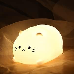 "Cat Night Light with long-life battery and soft silicone material. Soft brightness and 7 color changes. Adorable whale design. Perfect for kids' bedrooms."#CatNightLight #KidsNightLight #NurseryLamp #LEDNightLight #SoftBrightness #BreathingColor #BabyNightLight #WhaleDesign #BedtimeEase #DiaperChanging #Breastfeeding #AdorableDesign Kids Lighting Bedroom, Lamp Cute, Cat Nursery, Cat Night, Cat Lamp, Gatto Carino, Cute Night Lights, Nursery Lighting, Cute Shark