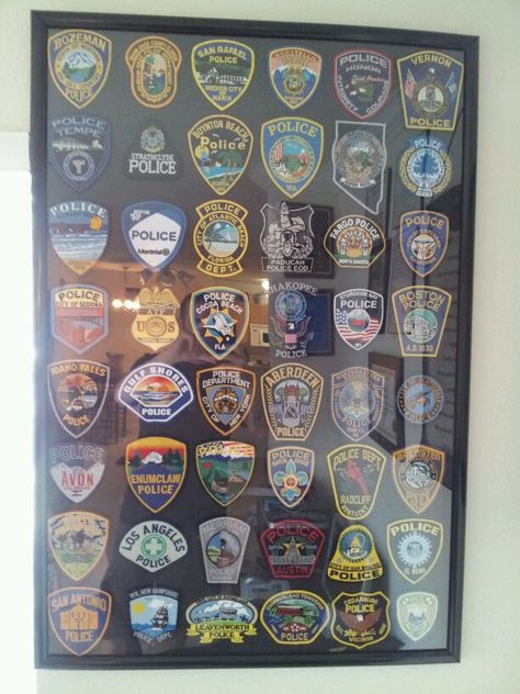 Police patch collection Police Patches Collection Display, Police Patch Display Ideas, Police Badge Display Ideas, Police Patches Display, Patch Display Ideas, Morale Patch Display, Patch Display, Firefighter Home Decor, Patches Display