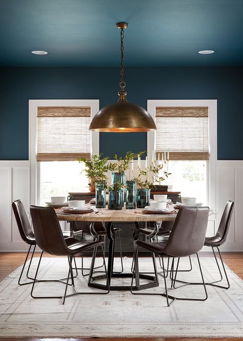 Using this deep blue jewel tone on both the ceiling and the walls really helped to define the dining room. I love the way the color is contrasted against the clean, white wainscoting and trim. Colors That Go With City Loft, Small Tudor Style Homes, Room With Blue Walls, Warner House, 2023 Decor, White Wainscoting, Trendy Interiors, Dining Room Blue, Dining Room Remodel