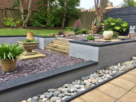 Originally sloping grass. Retaining walls built, lighting installed, back fill, planting, plum slate added and feature planting. Plum Slate Garden Ideas, Slate Garden Ideas, Plum Slate, Slate Garden, Retaining Walls, Garden Features, Retaining Wall, Slate Grey, Planting