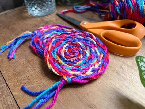 DIY No-Sew Rainbow Braided Yarn Coasters Yarn Coasters Diy, Craft With Yarn, Braided Coasters, Yarn Craft Ideas, Yarn Lanterns, Yarn Coasters, Yarn Keychain, Cozy Crafts, November Art