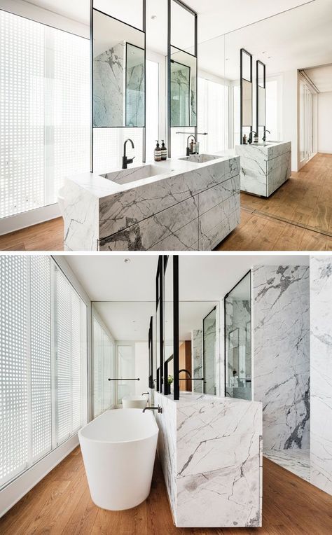 In this modern master bathroom, a double sink vanity is positioned in the center of the room, while a freestanding bathtub is located behind the vanity, and a full wall mirror makes the room feel twice as big. #ModernBathroom #BathroomDesign #EnsuiteBathroom Full Wall Mirror Bathroom, Madeleine Blanchfield, Full Wall Mirror, Big Bathroom, Bathroom Big, Luxury Bathroom Master Baths, White Wall Mirrors, Mirror Wall Living Room, Mirror Wall Bedroom