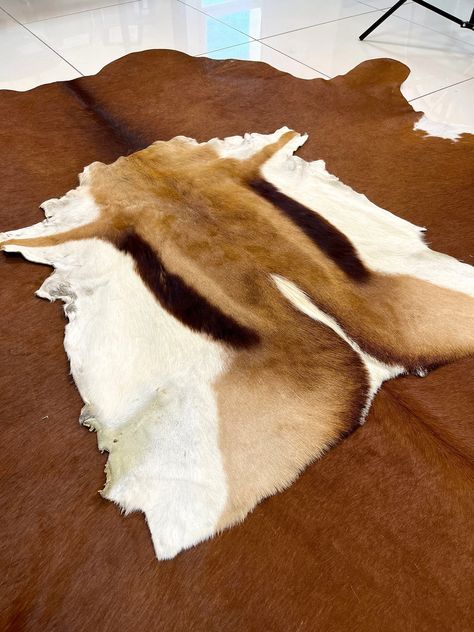 Genuine Deer Pelt Natural color , Natural Color Natural Pelt Delivery in 1-3 working days by Express Shipping This is a luxurious tanned blesbok hide which can be used as a floor rug, table cover, sofa cover or to manufacture products. Many our clients use these skins to drape over a sofa or table. Would be perfect for floor, furniture coverings or even as a wall hanging. There is no maintenance needed, just vacuum them on low probably twice a week (whenever needed). Please take note that colors Furniture Coverings, Huge Animals, African Antelope, Floor Furniture, Fur Carpet, Deer Hide, Animal Hide, Hide Rug, Cover Sofa