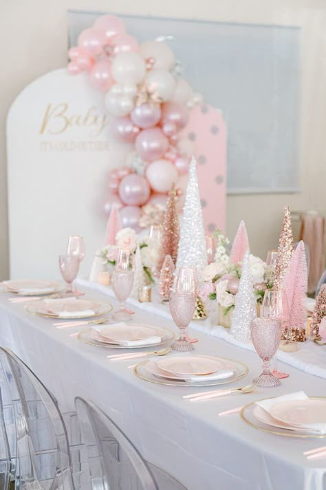 Step into a winter wonderland fit for a little princess! 🎀❄ Our 'Baby, It's Cold Outside' themed baby shower for a baby girl is a dream come true. Imagine pink Christmas trees glistening in faux snow, surrounded by fresh florals that add a touch of elegance. Our event is a vision of loveliness, with larger-than-life pink Christmas trees and enchanting balloon backdrops that set the stage for a magical celebration. Elegant Winter Wonderland Party, Pink Christmas 1st Birthday, Baby Its Cold Outside Baby Shower Ideas For Girl, Pink Winter Wonderland 1st Birthday, Pink Baby Shower Winter, Pink Winter Wonderland Party Decorations, Winter Wonderland Pink Baby Shower Ideas, Sweet One Christmas Birthday, Winter Pink Baby Shower