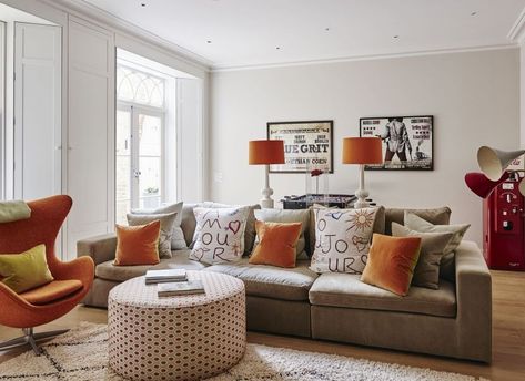 The burnt orange, taupe, and white make for a calm and welcoming sitting room. Texture is added in the wool and velvet fabrics giving depth, and the added fun cushions finish it off. Here's how to get this young modern living room design in your home https://www.fabricsandpapers.com/ideas-advice/burnt-orange-and-white-living-room #Lounge #Apartment #Stylish #ColorScheme #HomeInspo Burnt Orange Living Room Decor, Terracotta Living Room, Burnt Orange Living Room, Green Sofa Living, Brown Living Room Decor, Cream Living Rooms, Living Room Orange, Cosy Living Room, White Oak Floors