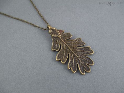 This bronze oak leaf pendant makes the perfect literary gift for fans of fantasy fiction. The large oak leaf pendant is 2 inches (50mm) long. The 2mm chain is a standard 20 inches in length. If you would like your necklace shorter, leave a note at checkout. If you would like it longer, you can purchase extra length here: https://www.etsy.com/listing/224341493/add-extra-length-to-your-necklace You can also choose to have it hung from an adjustable black cotton cord instead of the chain. For large Ranger's Apprentice, Halloween Costume Jewelry, Oak Leaf Necklace, Rangers Apprentice, Hammacher Schlemmer, Literary Gifts, Themed Gifts, Oak Leaf, Gifts For Readers