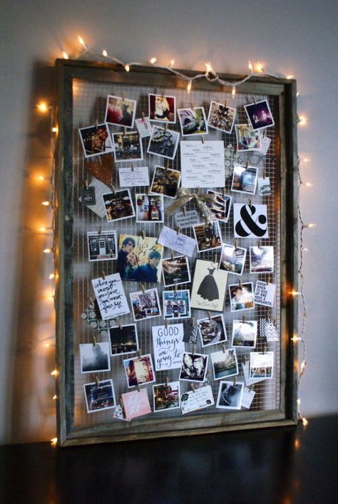 By removing the glass interior and adding wire, you can elevate an old frame into a beautifully crafted photo collage-esque display. Bonus: Add string lights around the frame to create a soft glow. Get the tutorial at Anastasia Co.   - CountryLiving.com Projek Kayu, Photo Collage Diy, Diy Dorm Decor, Dorm Diy, Polaroid Wall, Old Picture Frames, Hemma Diy, Photo Board, Decoration Photo