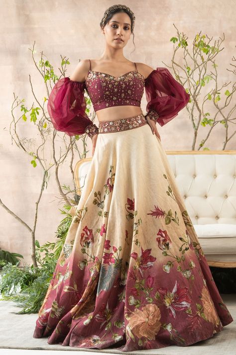 Featuring a multi colored lehenga in dola silk base with hand painting and floral print. It is paired with a matching embroidered corset blouse having puffed sleeves.    FIT: Fitted at bust and waist.  COMPOSITION: Dola silk.  CARE: Dry clean only. Lahanga Models, Hand Painted Lehenga, Painted Lehenga, Trending Lehenga Designs, Simple Lehenga Designs, Indian Bridesmaid Dresses, Simple Lehenga, Latest Bridal Lehenga, Wedding Lehenga Designs