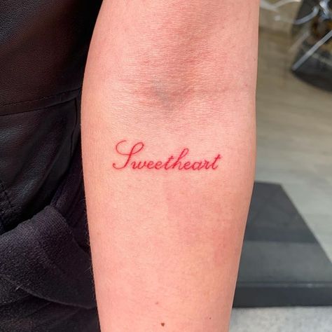 Red Ink Quote Tattoo, Love Looks Pretty On You, Lover Word Tattoo, Lovely Tattoo Word, Lover Girl Tattoo, Small Inner Arm Tattoos For Women, Short Phrases Tattoo, Word Tramp Stamp, Pretty Tattoo Fonts