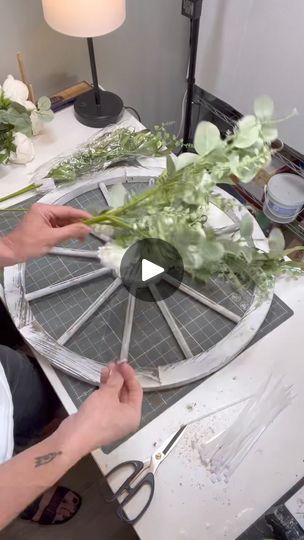 📣SOUND ON📣

Follow along as I create an artificial floral arrangement on a wagon wheel! | By How I See It Blog, LLC | Let's work on a wagon wheel
design today in this video. Doing something a little
different out of the box by adding some florals and
greenery to a wooden wagon wheel. This wagon wheel was
actually purchased at the at home store but you can find
lightweight wagon wheels in items such as this at a variety
of different places. And my greeneries and florals that I'm
using today are from Greenery Gal. I'll make sure that I drop
the link in the comments for her shop. Also, if you're a
member of Cody's Creative Community Virtual Membership
Group, make sure that you guys use your discount code for her
as well when you're shopping. Now, you'll see that I'm taking
the two different Christmas Wagon Wheel Wreath, Diy Wagon Wheel Decor, Wagon Wheel Christmas Decor, Wagon Wheel Decor Outdoor, Diy Wagon Wheel, Wagon Wheel Wreath, Wagon Wheel Decor, Wooden Wagon Wheels, Little White Flowers