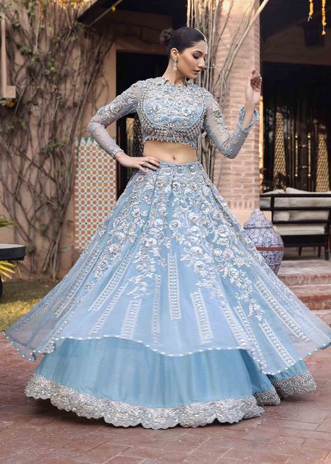 Include: Choli Lehnga Dupatta Fabric: Organza/ Raw Silk Color: Ice blue Work Technique: Embroidered Description: an ice blue double layered lehnga adorned with silver tillacrystal florals and celestial filigree rendered using zardozi,naqshi/dabka and stones. Paired with a meticulously hand workeddupatta and choli. This is a 3 Piece stitched outfit. Disclaimer: The color of the outfit may vary due to lightening effect of photography Modern Lehangas, Lehenga Choli Pakistani, Blue Bridal Lehenga, Sky Blue Lehenga, Blue Lehenga Choli, Indian Dress Up, Bridesmaid Lehenga, Simple Lehenga, Sky Blue Dress