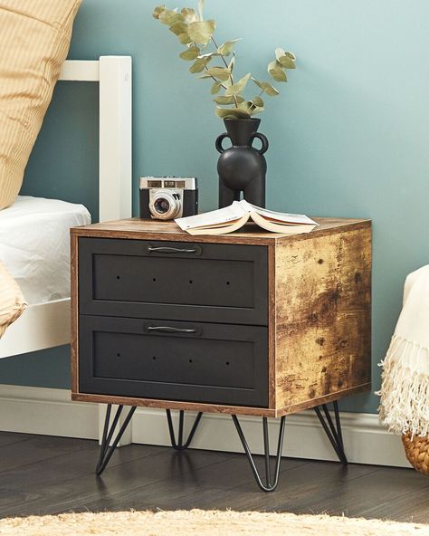 This practical bedside table is an essential piece of bedroom furniture that provides extra storage space. Designed in a modern style, it features black metal hairpin legs that add an industrial touch to your interior. The nightstand is made of high-quality particle board and comes with two capacious drawers.  Details: Color: Black, Dark Wood. Main material: Particle Board. Additional material: Steel, Iron.  Weight: 13 Assembly: Full Assembly Required Legs Height: 15 Dark Wood Bedside Table, Dark Bedside Tables, Industrial Style Bedroom, Estilo Dark, New York Loft, 2 Drawer Nightstand, Extra Storage Space, Particle Board, Style Moderne