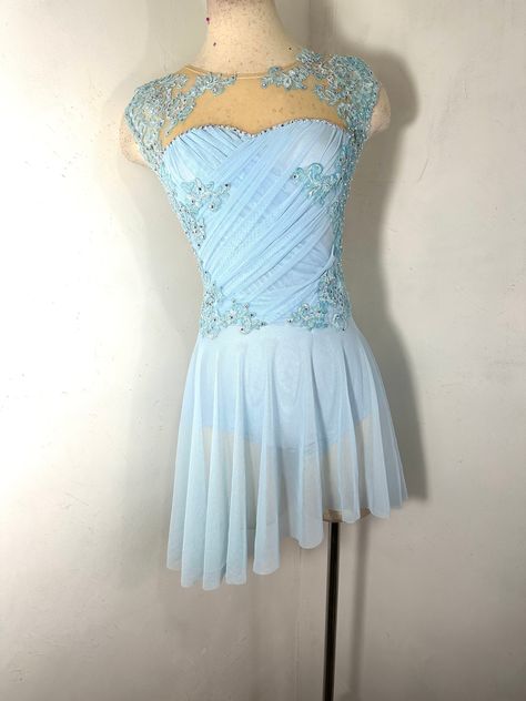 This Figure skating dress has a gorgeous and unique custom draped bodice with a novelty appliqued trim that is rhinestoned with Preciosa crystal ab rhinestones.  The circle skirt is assymetrical or rwquest a different skirt Crystal ab stones in size 20 mm have been added ( about 500-600) Gorgeous in this color way but can also be custom ordered in another color.  Can be custom made to your measurements.     Every one is unique depending on trim availability and slight variations in draping You can add additional rhinestones to your order ( they are also sold separately)  VERY IMPORTANT  ALWAYS Be sure to provide your measurements, due date and contact information in the notes  section of your order.  that is our contract and all pertinent information needs to be on your receipt not in a me Blue Skating Dress, Ice Skating Dresses Costumes, Ice Skating Costumes, Figure Skating Competition Dresses, Blue Drapes, Figure Skating Costumes, Figure Skating Dress, Ice Skating Dresses, Dance Hairstyles