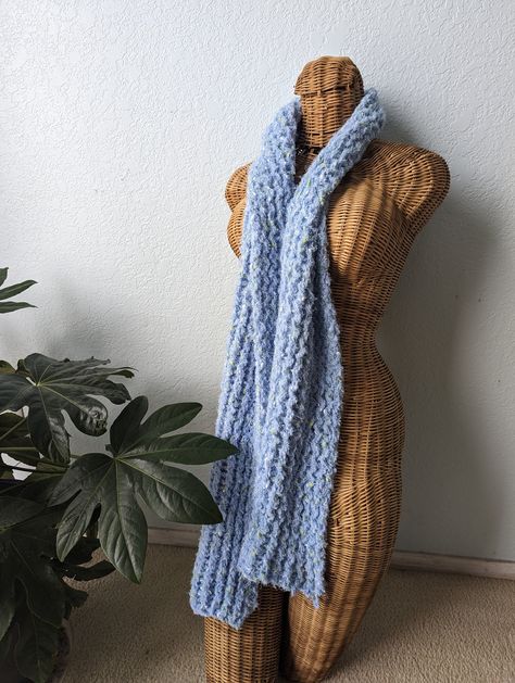 This light weight knit scarf is light blue with flecks of white and yellow. It measures about 5.5in wide and 67in long making it easy to bundle up and stay cozy in! Chunky Scarf, Chunky Scarves, Blue Crochet, Blue Scarf, Stay Cozy, Knit Scarf, Scarf Wrap, Knitted Scarf, Scarf Accessory