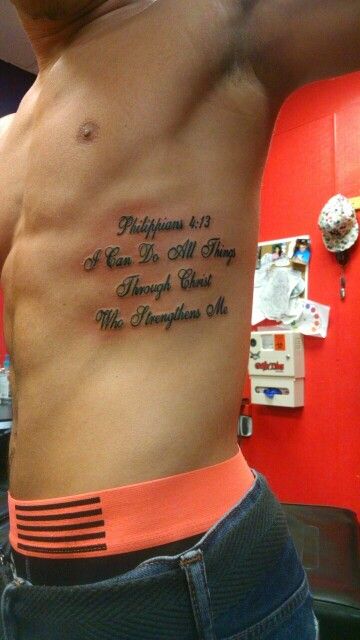 Side Tattoos For Men Ribs Quotes, Philipians4:13 Tattoo Men, Tattoos On Ribs Men, Bible Verse Stomach Tattoo, Rib Men Tattoo, Ribs Quote Tattoo, Men’s Small Rib Tattoos, Bible Verse On Ribs Tattoo, Men’s Rib Tattoo Ideas