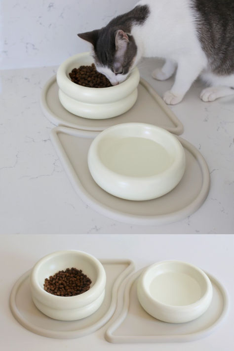 A gray and white cat enjoys kibble from the Halo Cat Bowl, part of the Relish Bundle by Catenary Home, which includes stackable ceramic bowls paired with stylish and functional Drop Pet Mats. The minimalist dining set is designed for both aesthetics and health, preventing whisker fatigue and offering easy clean-up for cat owners. Cat Food Mat, Elevated Cat Bowls, Ceramic Cat Bowl, Modern Cat Furniture, Cat Eating, Living With Cats, Cat Food Bowl, Food Mat, Cat Bowl