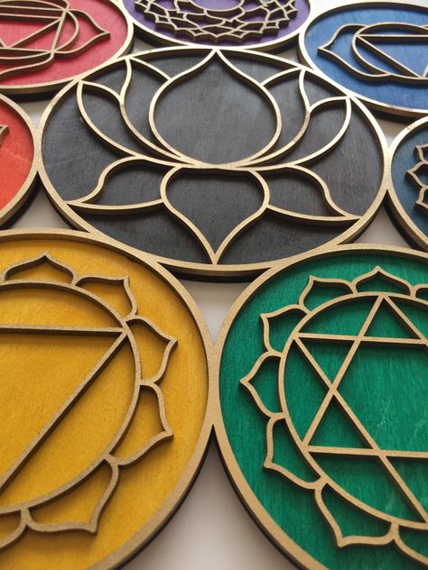 Chakra, Wall Art,  Sacred Geometry, Wood Chakra , Wall decor Materials: 4 mm Birch Plywood, 3 mm Plywood Number of layers - 2 colors - gold and chakras colors Colored with natural oils For more of our designs, check out our full shop! https://www.etsy.com/shop/Anatoliawood Sacred Geometry Art Mandalas, Chakra Wall Hanging, Simple Room Decoration, Chakra Decor, Wall Art Paint, Headboard Art, Wooden Living Room, Laser Cut Wood Crafts, Chakra Art