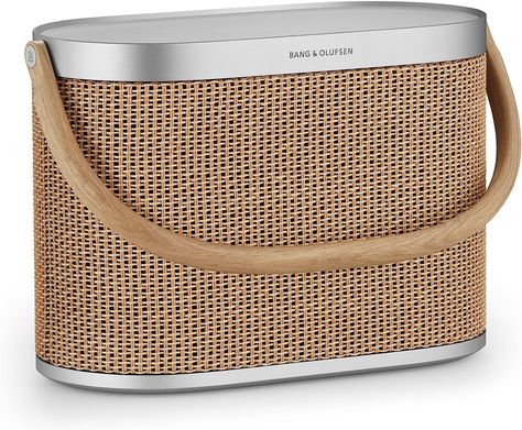 Okay, this one is pricey but it is SO gorgeous and the sound quality is supreme. Host a boujie pool party and impress all your friends Bang & Olufsen Beosound A5 - Portable Bluetooth Speaker with Wi-Fi Connection, Carry-Strap, "Nordic Weave" on AMAZON! PORTABLE: A compact, durable design with an elegant wooden handle, this portable speaker is at home in any room, park or outdoor space. 360° SOUND: whoa!& will connect to other B&O speakers WIRELESS: up to 12 hours of battery on a single charge. Speaker Accessories, Bang Olufsen, Big Battery, Waterproof Speaker, Bang And Olufsen, Charging Pad, Wireless Charging Pad, Portable Power Bank, Speaker System