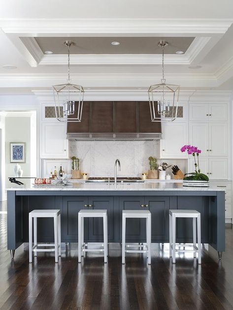 Two Darlana Lanterns hang from a small gray tray ceiling over a blue island fitted with a white marble countertop seating Emeco Counter Stools facing a sink with a satin nickel gooseneck faucet. Unique Ceiling Ideas Kitchen, Ceiling Design Over Kitchen Island, Tray Ceiling Above Kitchen Island, Ceiling Box Above Kitchen Island, Kitchen Tray Ceiling Ideas, Tray Ceiling Over Kitchen Island, Kitchen Island Ceiling Ideas, Ceiling Above Kitchen Island, Tray Ceiling Ideas Kitchen